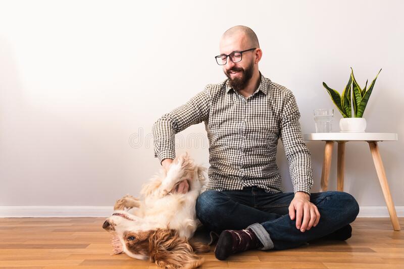 A person playing with his pet