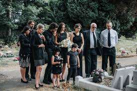 How to dress for a funeral? The rules of a delicate dress code