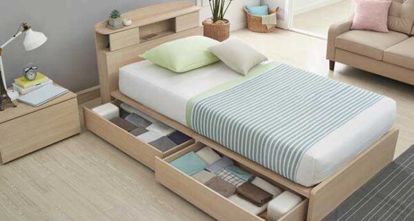 How can designer bedroom furniture contribute to a space?